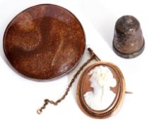 Mixed Lot: large circular shaped sandstone brooch in a white metal mount, a carved shell cameo