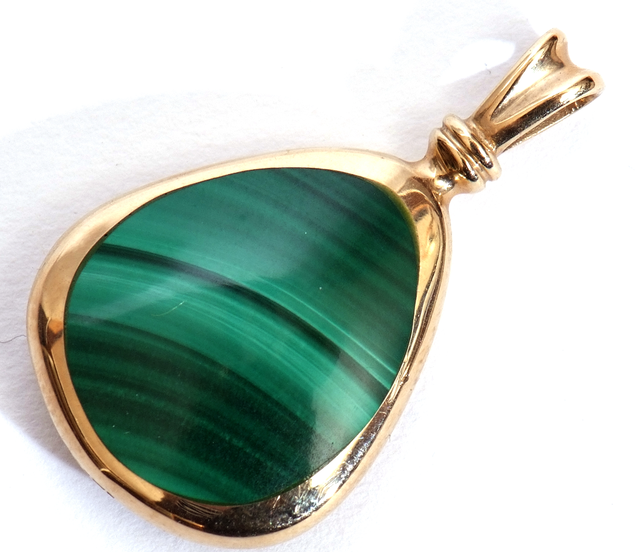 An onyx and marcasite double sided pendant, pear shaped in a 9ct gold frame, Sheffield 1995