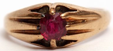 9ct gold signet ring, claw set with a red stone, raised between textured shoulders, size O/R