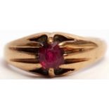 9ct gold signet ring, claw set with a red stone, raised between textured shoulders, size O/R