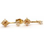 Pair of 18ct gold and diamond pendant earrings featuring a cluster of 4 small diamonds on a bar to a
