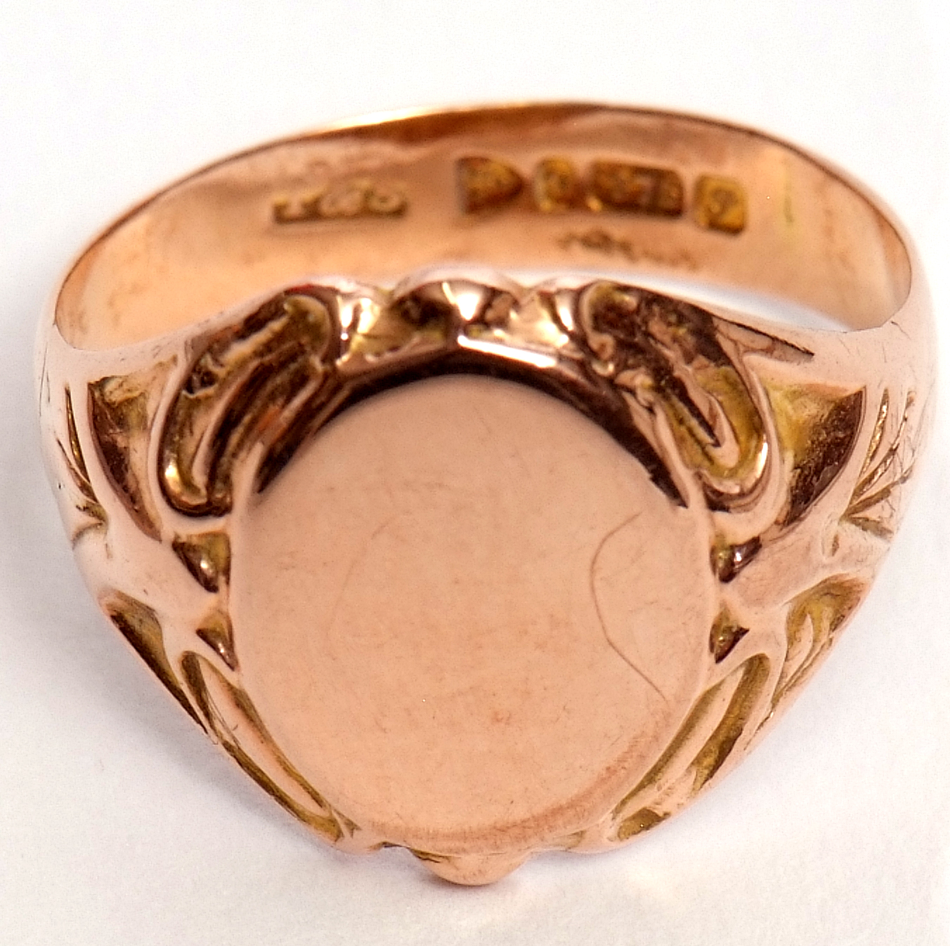 Early 20th century 9ct gold signet ring, the plain oval panel raised between carved shoulders, - Image 6 of 6