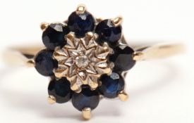 Sapphire and diamond cluster ring, the central single cut diamond in an illusion setting