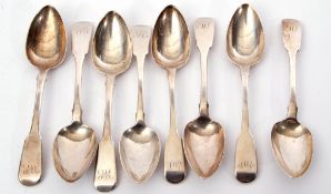 Group of eight Georgian dessert spoons in Fiddle pattern including four London 1825 by George