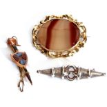 Mixed Lot: 9ct stamped Scottish agate brooch, a sword and shield design, a 925 stylised brooch,