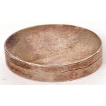 George III patch or pill box of plain polished oval form, the hinged lid opening to reveal a gilt