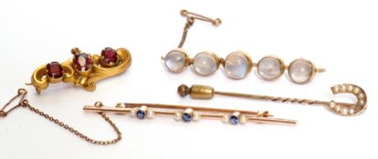 Mixed Lot: moonstone brooch, sapphire and seed pearl brooch, gilt metal and garnet scroll brooch,