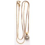 Precious metal small diamond set flower head pendant suspended from a 9kt stamped chain, gross