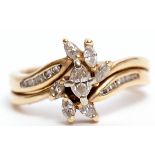 Modern diamond cluster cross-over ring, with seven marquise cut diamonds raised on diamond set