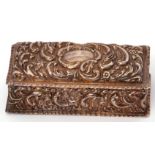 Edwardian rectangular dressing table box with heavily embossed decoration of flowers and foliage,