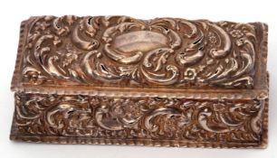 Edwardian rectangular dressing table box with heavily embossed decoration of flowers and foliage,