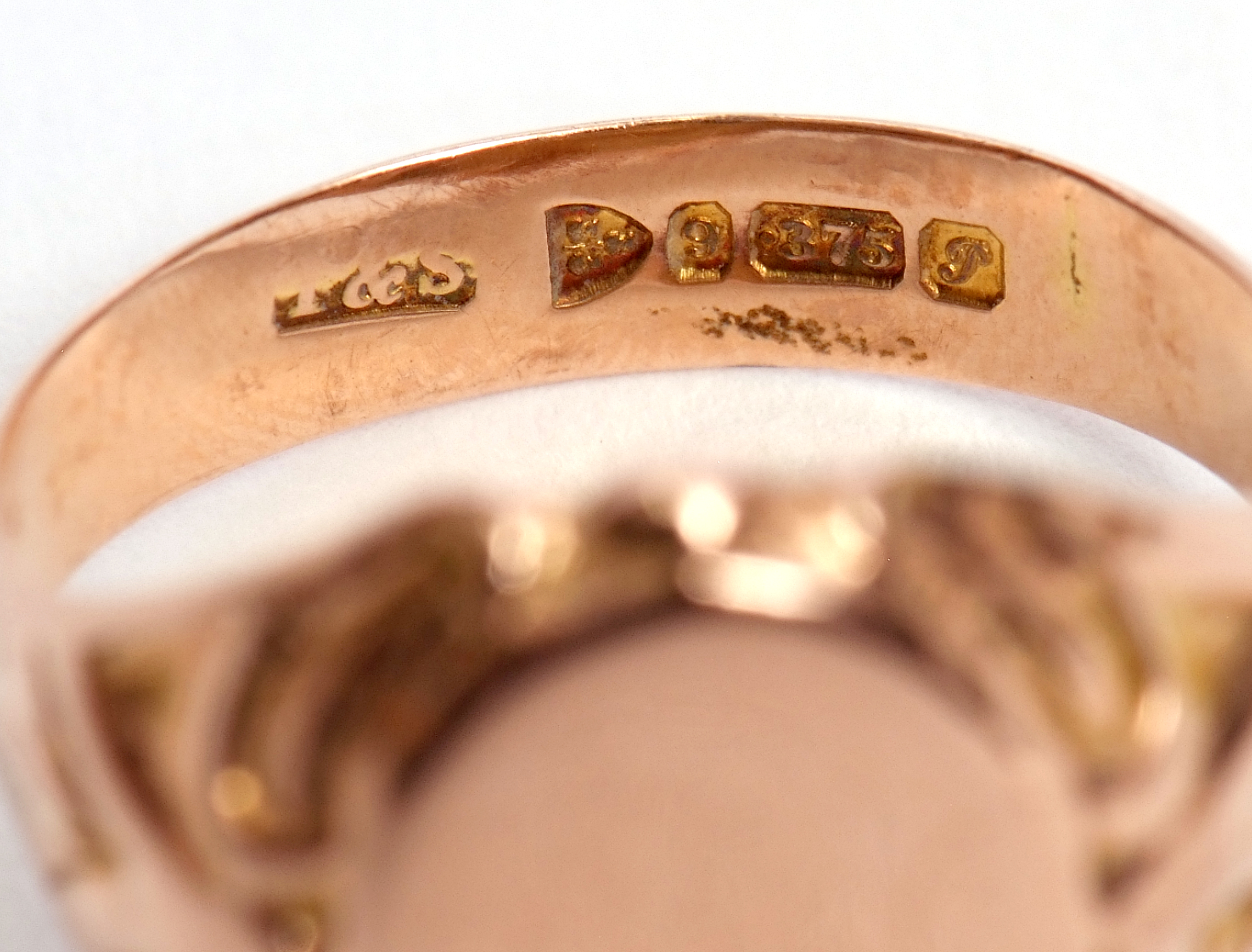Early 20th century 9ct gold signet ring, the plain oval panel raised between carved shoulders, - Image 5 of 6