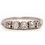 Precious metal five stone diamond ring featuring 5 old cut diamonds, individually claw set and