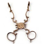 Pair of early/mid 18th century sugar scissors of scroll work design having a concealed hinge,