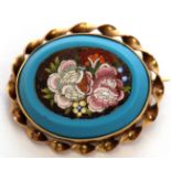 Vintage micro-mosaic brooch, floral design, in a blue hardstone surround within an ornate yellow