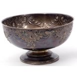Edward VII pedestal bowl of circular form embossed with flowering plants and scrolls, plain
