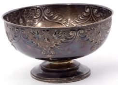 Edward VII pedestal bowl of circular form embossed with flowering plants and scrolls, plain
