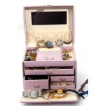 Pink leatherette jewel box to include a rolled gold bracelet, various brooches, lapis pendant, wrist