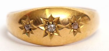 Edwardian 18ct gold and diamond three stone ring featuring three small single cut diamonds, each
