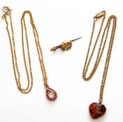 Mixed Lot: modern 9ct gold and ruby pendant on a 9kt stamped trace chain, a 9ct gold trace chain