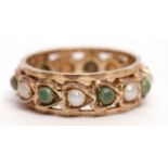 9ct gold eternity ring alternate set with seed pearls and green stones in a Celtic style, size J