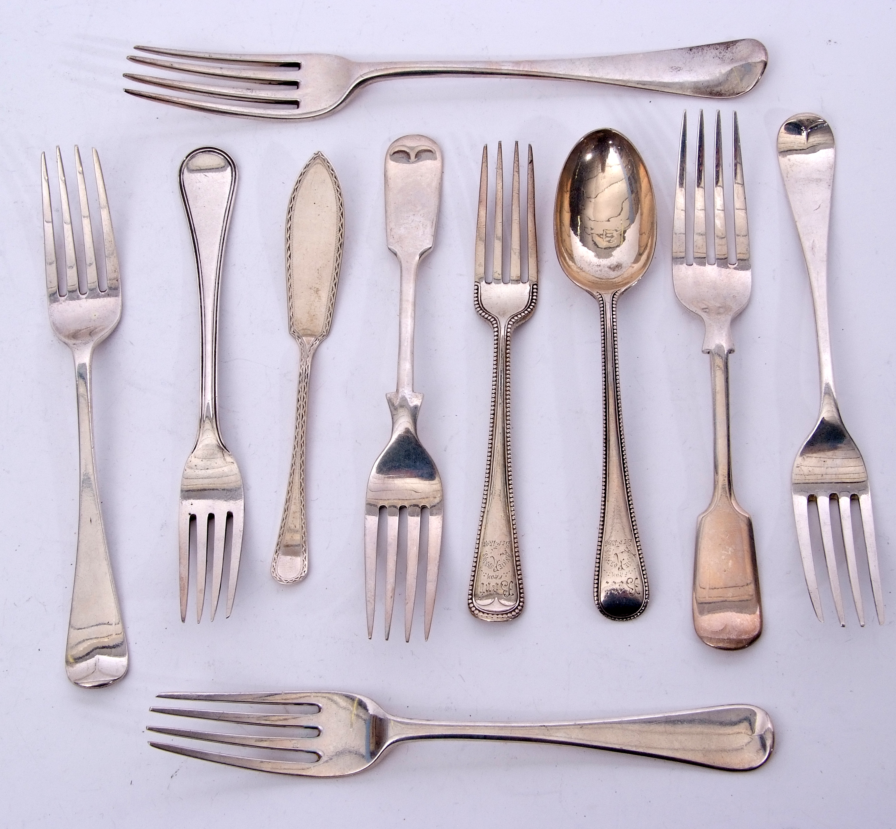 Mixed Lot: Georgian and later flatwares including a table fork, seven dessert forks, large tea spoon