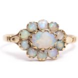 9ct gold and opal cluster ring, an oval design with central large opal within a surround of 10 small