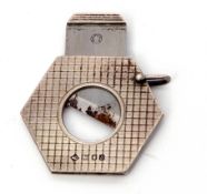 Elizabeth II silver encased and steel bladed cigar cutter of hexagonal form with engine turned