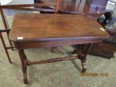 EDWARDIAN WALNUT FOLD OVER CARD TABLE ON RING TURNED SUPPORTS