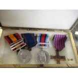 ONYX BOX CONTAINING FOUR MIXED MEDALS