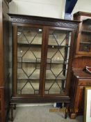 EDWARDIAN MAHOGANY ASTRAGAL GLAZED DISPLAY CABINET WITH FRETWORK CARVED DETAIL ON TAPERING SQUARE