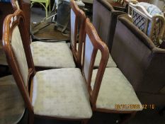 FOUR TEAK UPHOLSTERED FRAMED DINING CHAIRS WITH CREAM UPHOLSTERED SEAT AND BACK