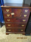 REPRODUCTION GEORGIAN STYLE CHEST WITH SEVEN DRAWERS RAISED ON BRACKET FEET