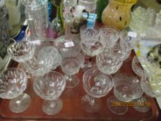 TRAY CONTAINING A PAIR OF GLASS DECANTERS, MIXED CHAMPAGNE GLASSES ETC