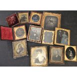 One box: 11 Victorian portrait ambrotypes, all cased or framed, (11)