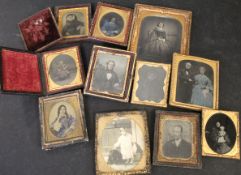 One box: 11 Victorian portrait ambrotypes, all cased or framed, (11)