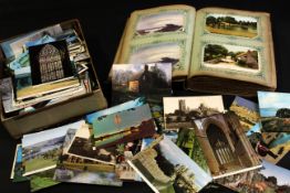 Old postcard album containing approx 200 mainly UK and foreign topographical early postcards, few