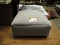 SMALL UPHOLSTERED TOP SQUARE FORMED FOOT STOOL RAISED ON BUN FEET