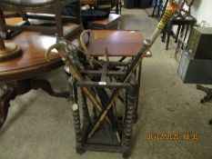 EARLY 20TH CENTURY OAK FRAMED BARLEY TWIST FOUR-SECTIONAL STICK STAND WITH A QUANTITY OF MIXED