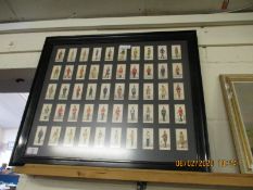EBONISED FRAMED SET OF CIGARETTE CARDS WITH MILITARY SOLDIERS