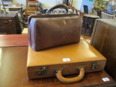 TAN LEATHER BRIEFCASE TOGETHER WITH A FURTHER GLADSTONE TYPE BAG