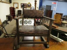 OAK FRAMED CHILD’S ARMCHAIR WITH LEATHER STRAP, UPHOLSTERED SEAT AND BACK