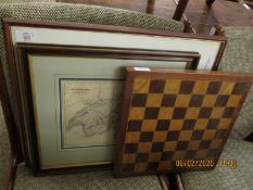 SATINWOOD AND MAHOGANY CHEQUERBOARD AND A FRAMED MAP OF SWITZERLAND AND A FURTHER MAP OF NORFOLK (