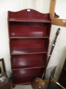 RED PAINTED FOUR FIXED SHELF BOOKCASE WITH PANELLED BACK