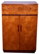 Art Deco Birds Eye maple tallboy with fitted interior and sliding drawer with leaf decoration to