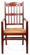 Arts & Crafts type oak chair with woven rush base, 110cm high