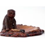 Unusual Bretby dish modelled with a monkey with glass eyes and a cigarette on a brown pottery