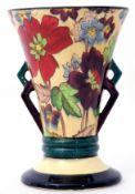 Flared vase with floral design and angular handles, the base stamped "British Roskyl Pottery" and