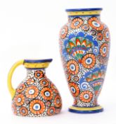 Group of Czechoslovakian pottery vases comprising a baluster vase with a polychrome design in orange