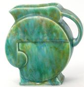 Beswick Art Deco jug shape 125 with a mottled blue and green design, 18cm high